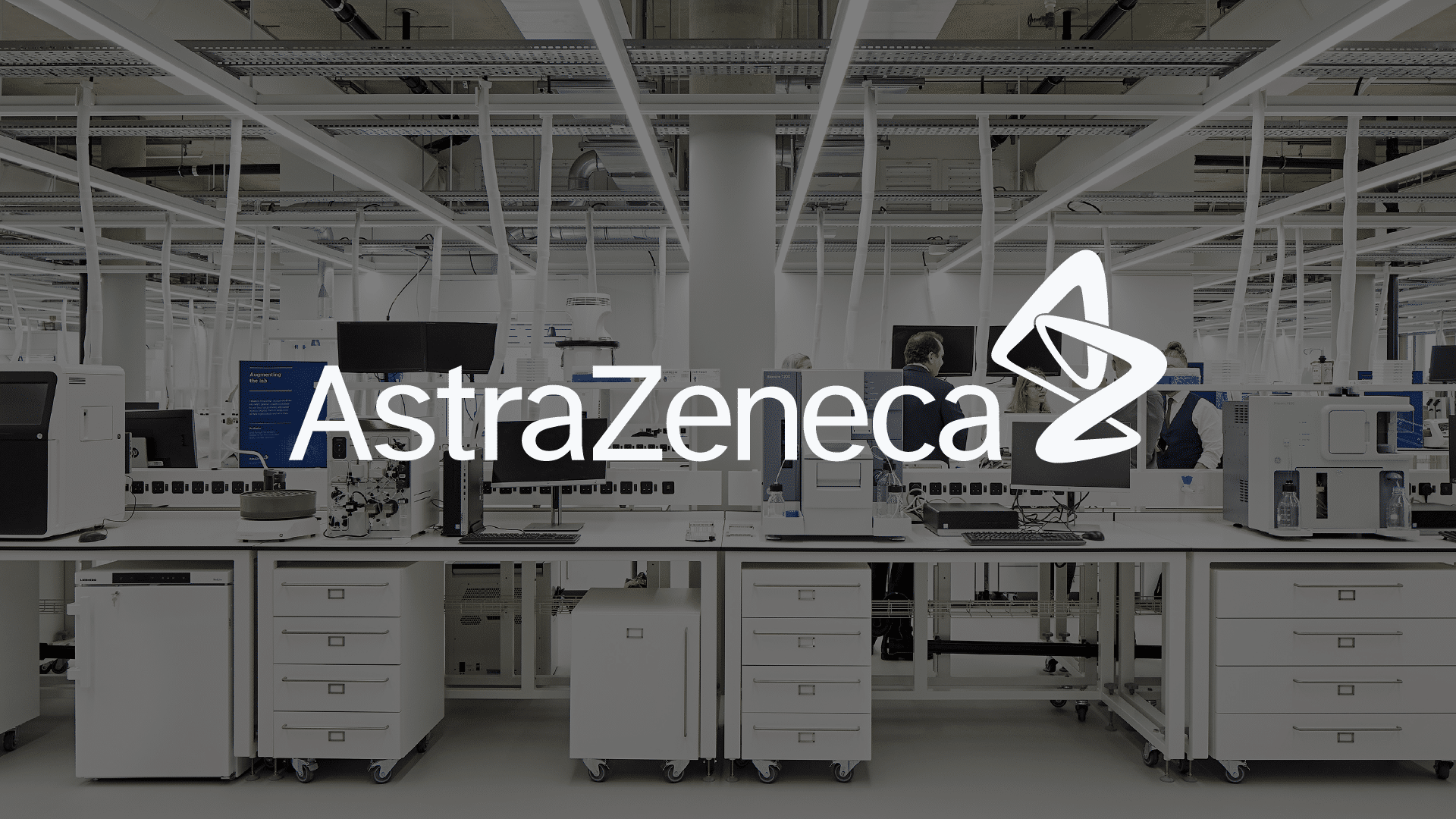 AstraZeneca case study header image, showing one of their labs and their logo